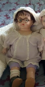 Doll with Celluloid spectacles Harbinger of 1910 Fashion